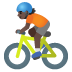 🚴🏿 person biking: dark skin tone display on Google